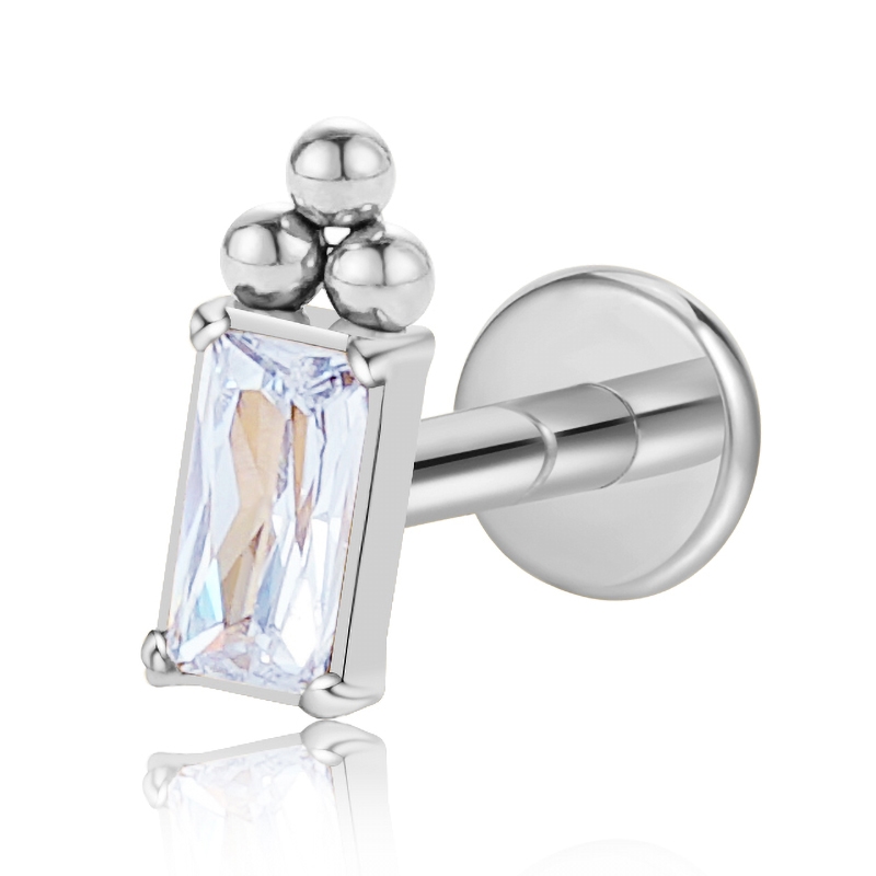 NK100059-1 16G G23 Titanium flat back labret stud featuring a clear rectangular CZ crystal with three metal beads on top.