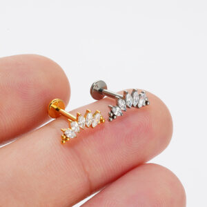 Fingertip size comparison of Gold and Silver titanium marquise fan cluster studs to visualize real-life scale.