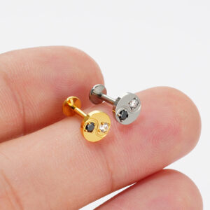 Close-up of Gold PVD Titanium Yin Yang stud with prong-set cubic zirconia.