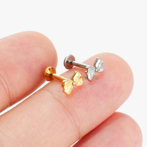 titanium bow flat back labret studs on finger for size reference